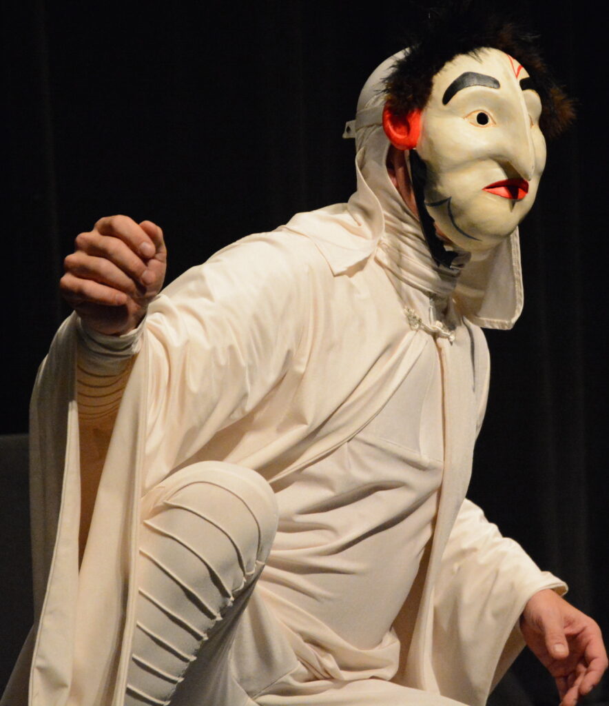 Jonathan Kipp becker performing with raven Boy mask in facing humanity