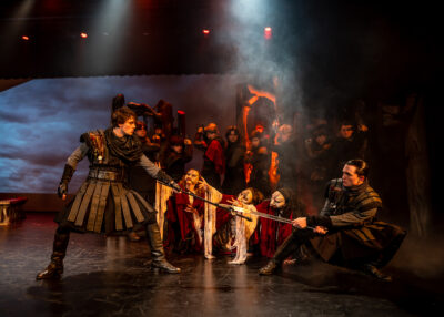 production shot of witches from macbeth
